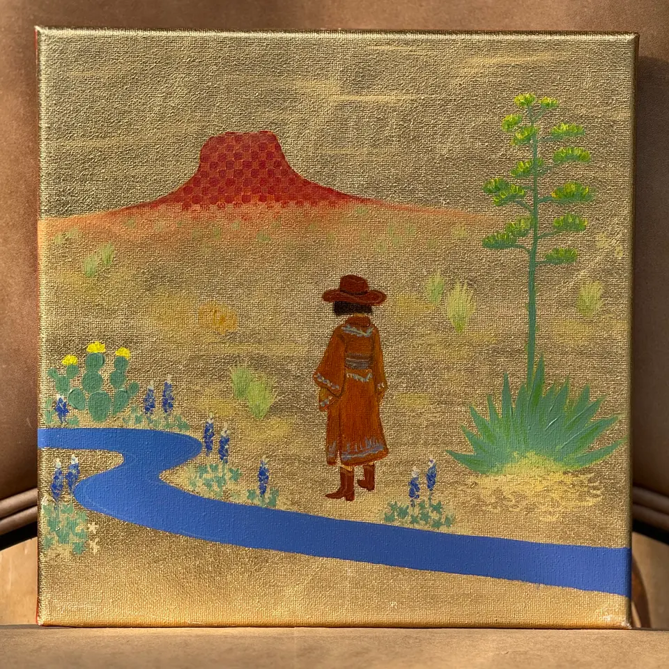 A red mesa and blue river in a colorful West Texas desert landscape.